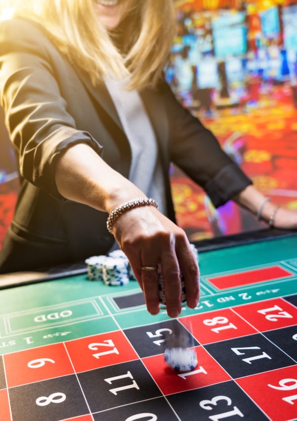 Woman playing roulette at the casino